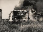 old photo of a building burning