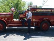 man with old fire truck