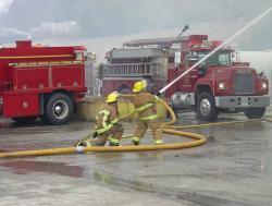 fire fighters with a hose